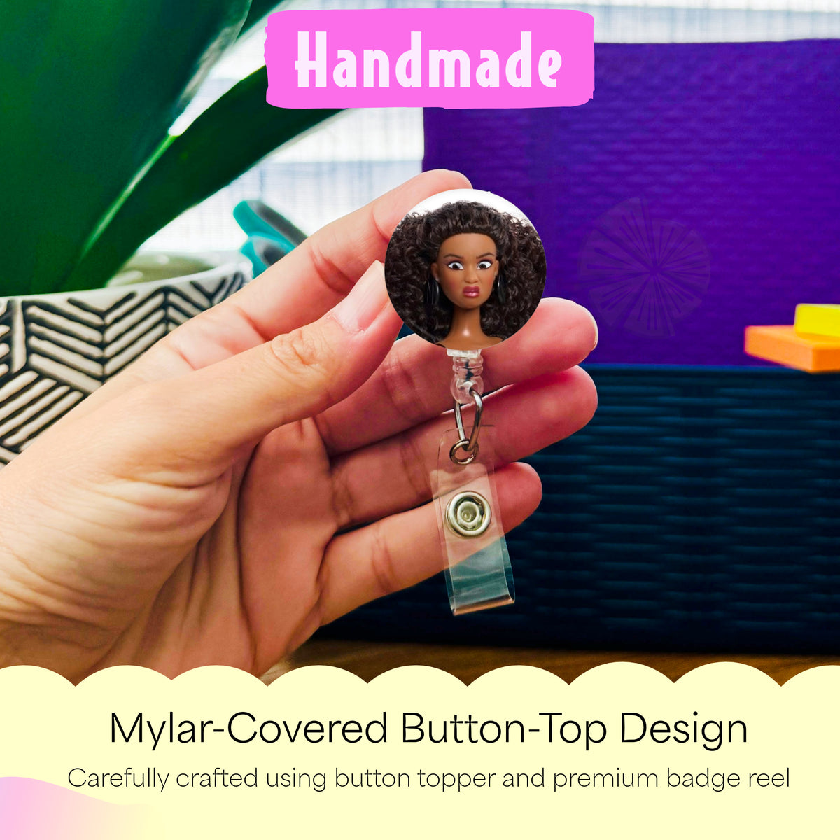 Hand holding the African American Cringe Doll handmade badge reel