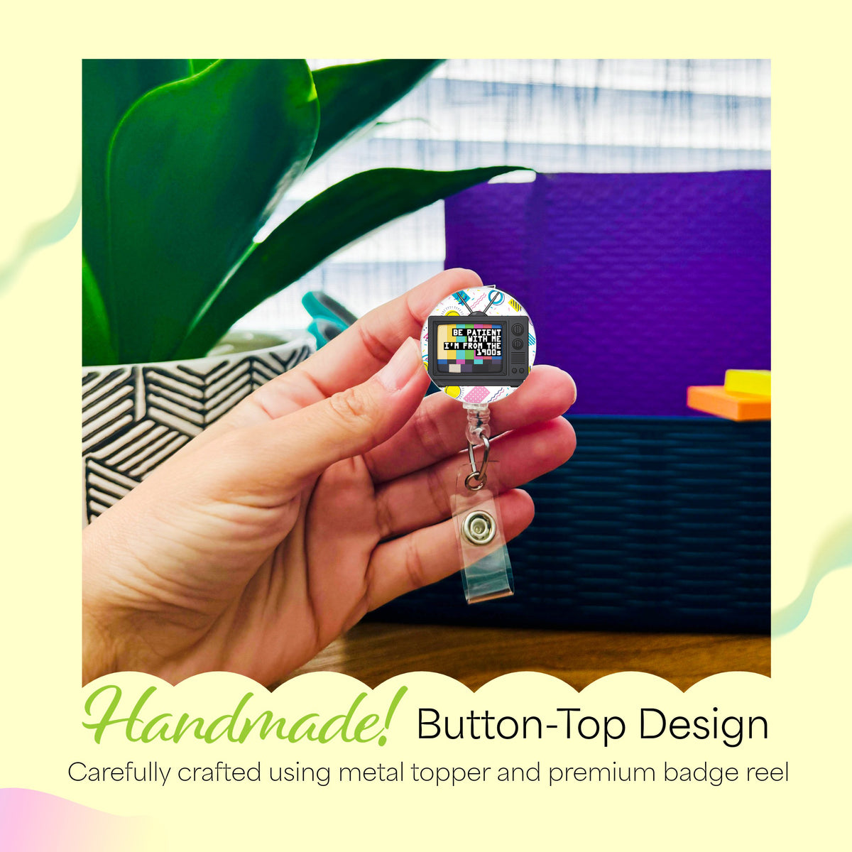 Hand holding the Be Patient with Me, I'm from the 1900s handmade badge reel
