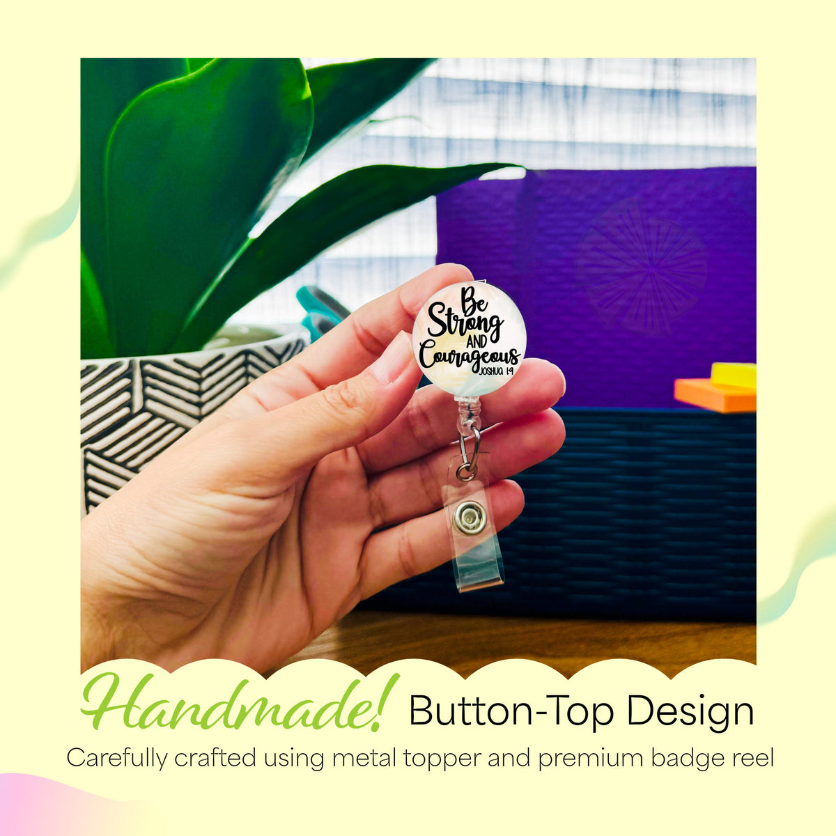 Hand holding the Be Strong and Courageous handmade badge reel