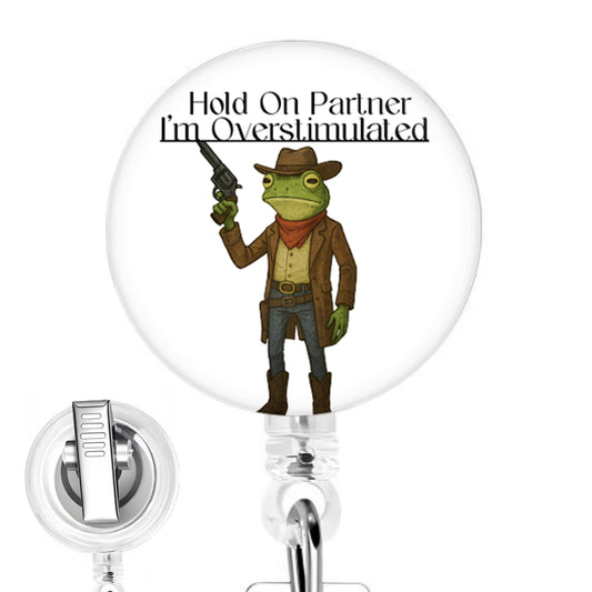 Hold On Partner, I'm Overstimulated Frog handmade button-top badge reel on a clear retractable reel