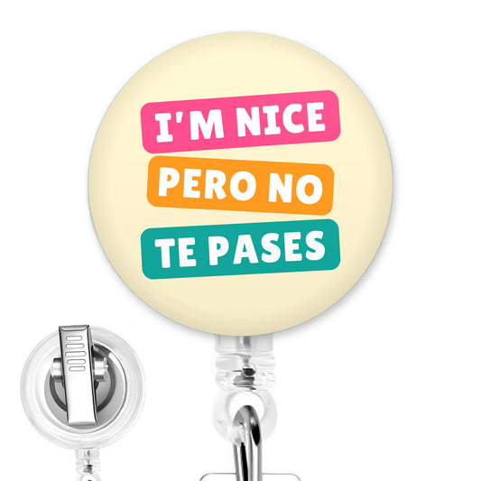 I'm Nice Pero No Te Pases handmade button-top badge reel on a clear retractable reel