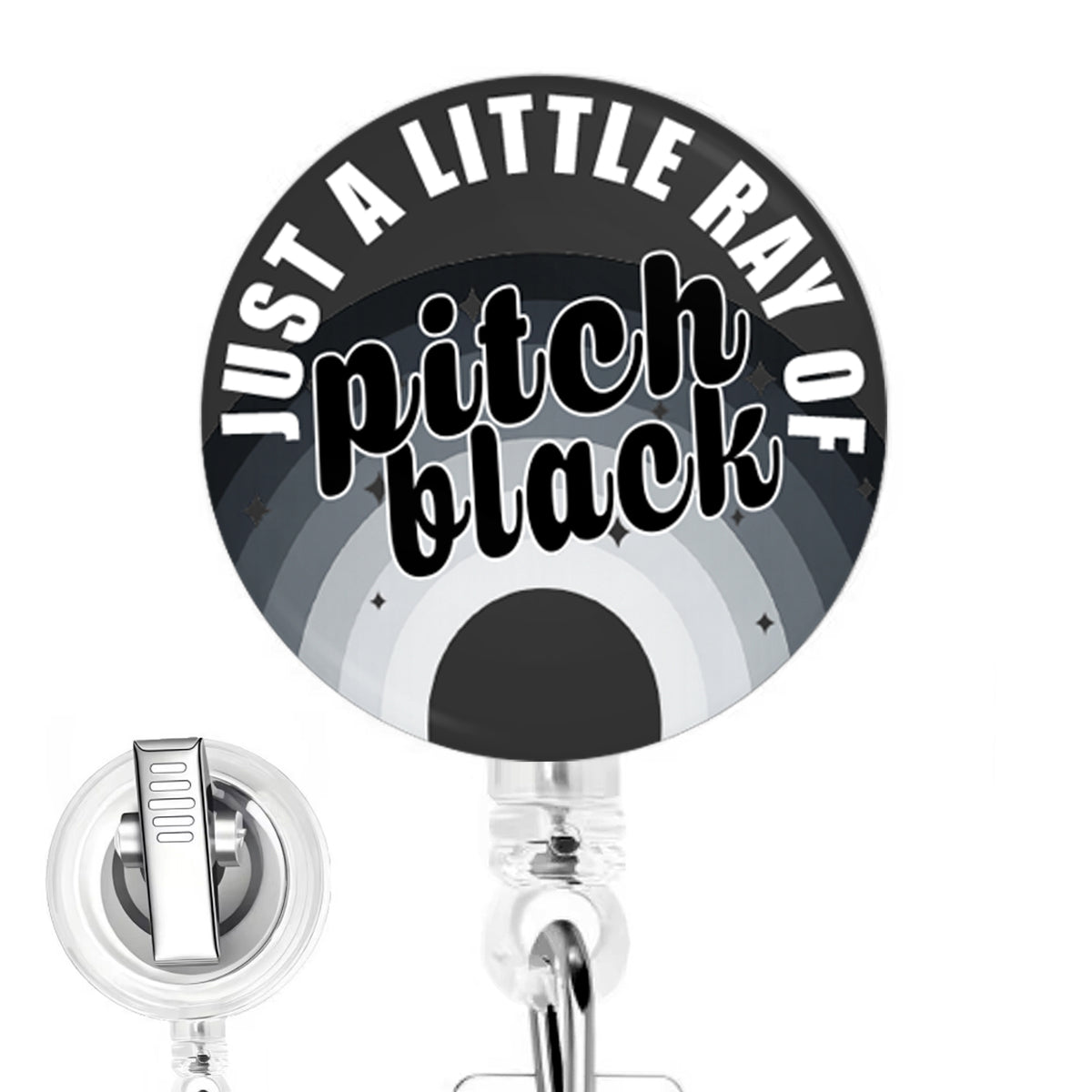 Just a Little Ray of Pitch Black handmade button-top badge reel on a clear retractable reel
