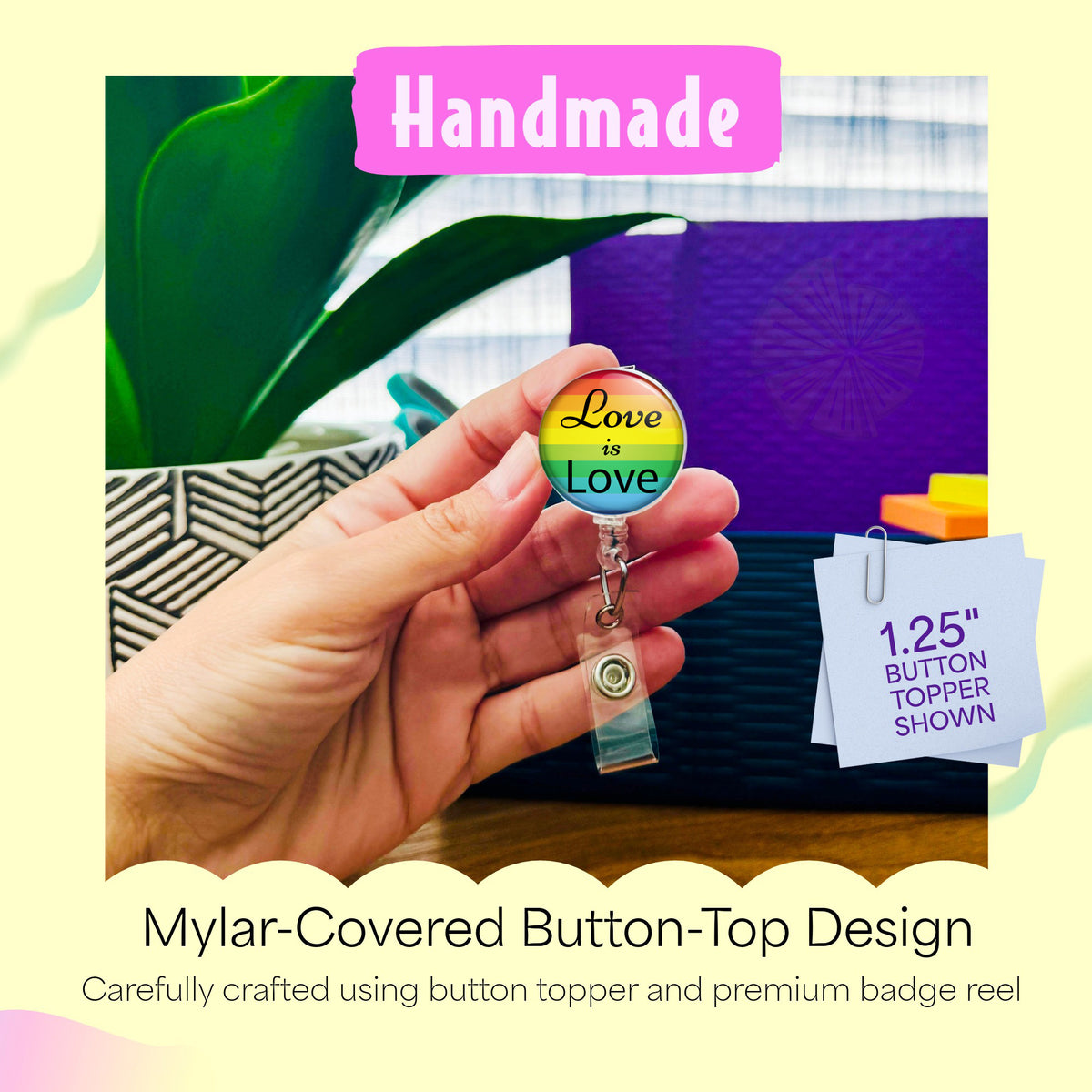 Hand holding the Love Is Love handmade badge reel