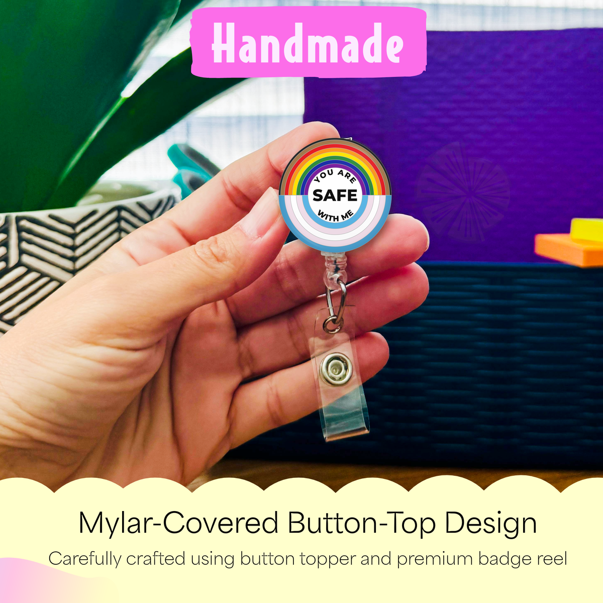 Hand holding the You Are Safe With Me handmade badge reel